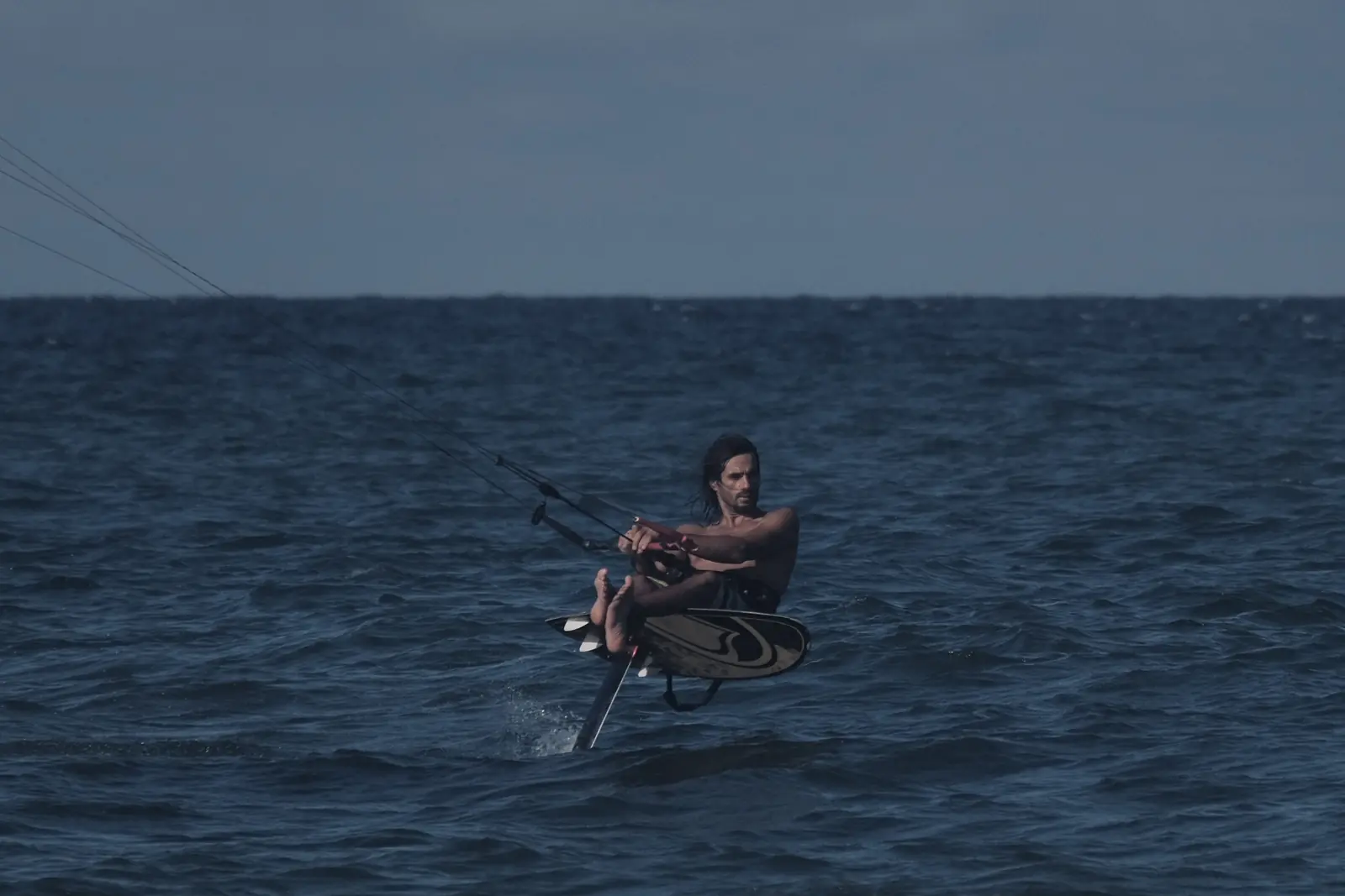 Foiling sitting style on the water