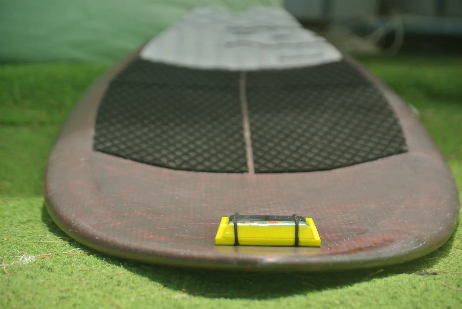 SmartSurf tracker on a surfboard